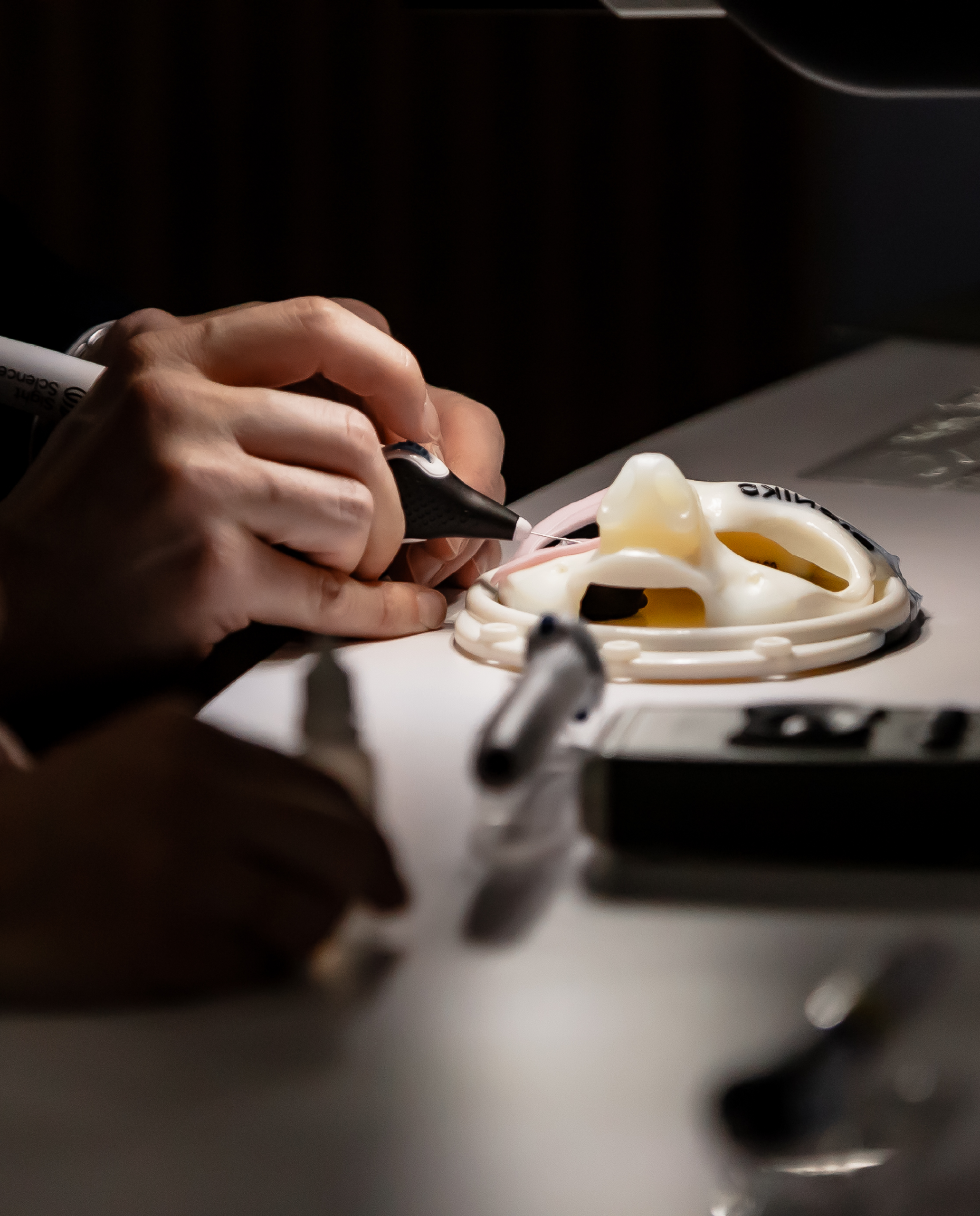 Picture of a user trying out the MIGS device at a test booth