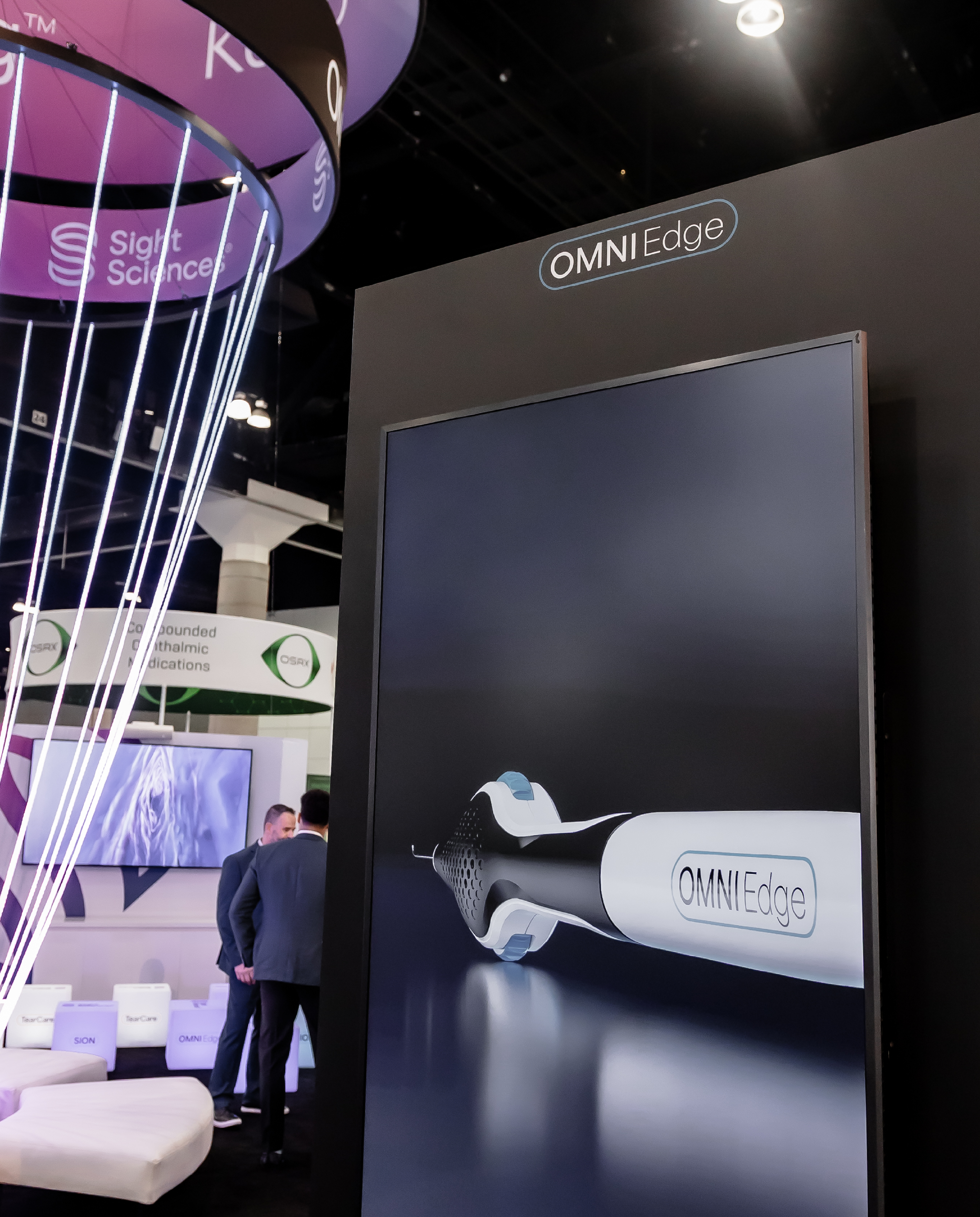 A large display showing the OMNI Edge product picture and some of the Sight Sciences booth